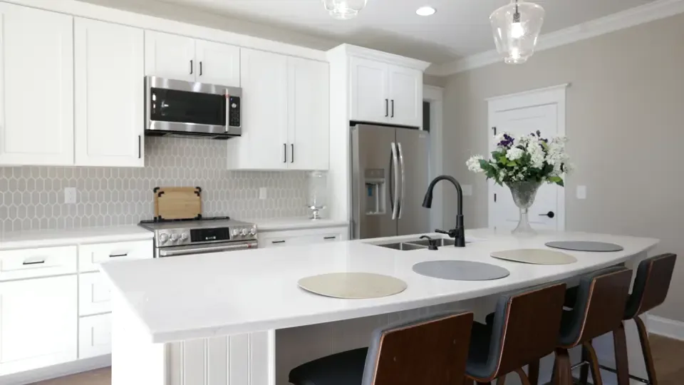 A spotless apartment kitchen with a center island